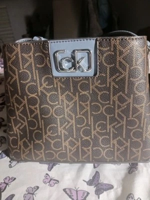 Calvin Klien Mini  Brown and Blue Crossbody Bucket. - Image 1 of 4