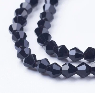 **A Pack Of 100 Black Faceted Glass 4mm Small Hole Beads - Image 1 of 3