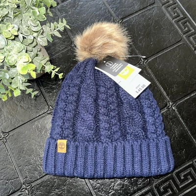 NUEVO CON ETIQUETAS Timberland Mujer Tejido con Cable Gorro Piel Puff Logo Forrado Vellón Azul Marino $45 OS Foto 1 de 4