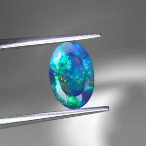 Oval Natur AAA Floral Flash Farbspiel Schwarz Opal 0,90ct 10x6mm Edelstein - Bild 1 von 14