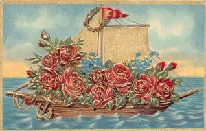 Postal: Felicitaciones más cordiales, barco de rosas doradas, en relieve - Imagen 1 de 2