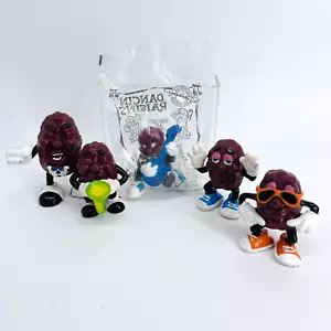 4 figuras de pasas de California 1987 de colección y guitarra Hardee's 2001 sellada - Imagen 1 de 20