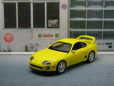 Toyota Supra MK4 gelb 1996 - Auto World (1/64) Modellauto Model Car - Bild 1 von 4