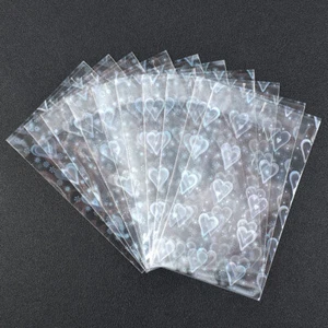 50Pcs Heart Pattern Foil Laser Bag Board Game Card Photo Sleeves Protector Pouch - Foto 1 di 16
