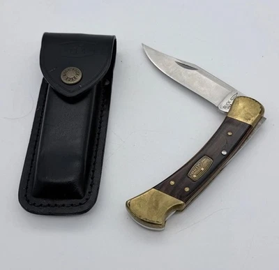BUCK USA 110 50TH ANNIVERSARY Obeche Wood Folding Hunter Knife + Leather Sheath - Image 1 of 4