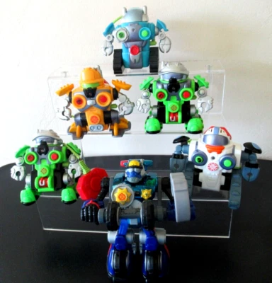 Lote de (6 héroes de rescate FP).  (1) TRANSFORMER, (5) ROBOTS, minibots, mochilas. Foto 1 de 4