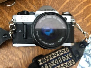 CANNON AE 1 PROGRAM CAMERA/LENS,FLASH, STRAP, CASE,PAPERS & PARTS - Picture 1 of 17