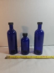 Set of 3 Cobalt Blue Glass Round Bottles (Black Cap) Holding - Picture 1 of 8