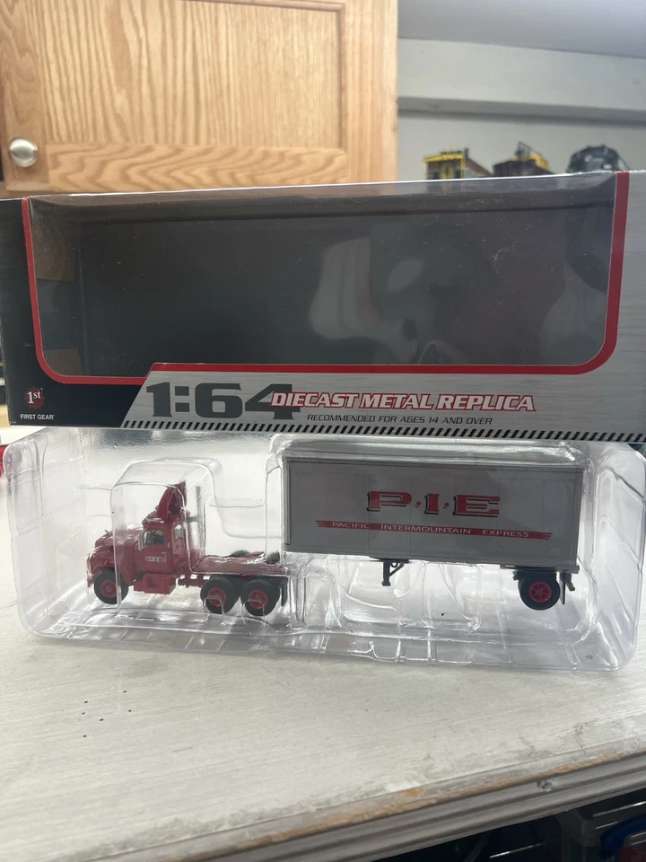 First Gear 1/64 Mack R Model And 28’ Trailer, P I E - Image 1 of 1
