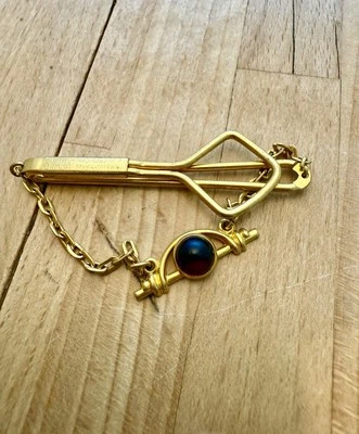 Swank Tie Bar with Red Cabochon Stone Dangling Chain Gold Tone Marked - Image 1 of 2