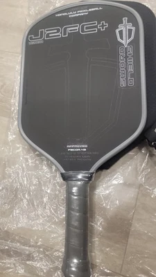 New Honolulu Sword & Shield J2FC+ Pickleball Paddle – Gen 4.5 – Black – 6" - Image 1 of 2