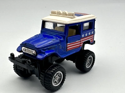 Tomica Tomy Big Foot #2 Toyota Land Cruiser, azul, 1:64, excelente Foto 1 de 4