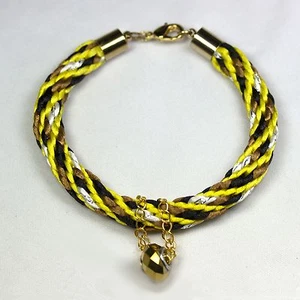 Pulsera de tweed Kumihimo con baratija - Imagen 1 de 1