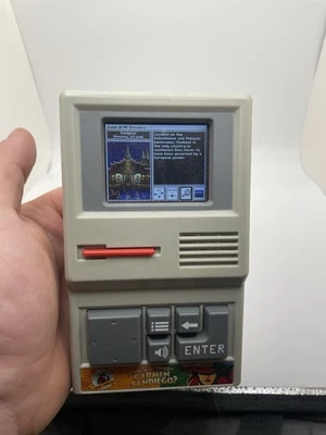 Basic Fun Where in The World Is Carmen Sandiego Handheld Electronic Game - 09613 - Image 1 of 4