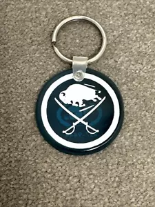 Vintage Buffalo Sabres Schlüsselanhänger International Cable 1980er Hockey Säbel Action - Bild 1 von 5