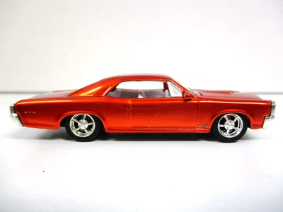 Pontiac GTO 1966 PRO-TOURING HOT WHEELS (NARANJA METÁLICO) - PILOTOS REALES - 1/64 Foto 1 de 4
