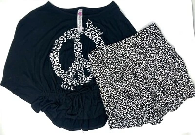 Conjunto de camisa y falda negra con estampado de guepardo de Nitworks para niñas talla mediana Foto 1 de 4
