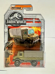 Camion Matchbox Jurassic World verde Mercedes-Benz Unimog U 5020 2018 - Foto 1 di 2