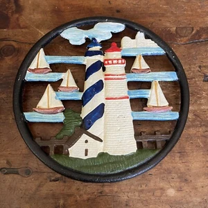 Cast iron trivet lighthouse sailboats nautical round Colorful Kitchen Decor Vtg - Picture 1 of 5