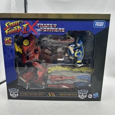 Transformers Collaborative Street Fighter II Mash-Up Hot Rod Ken vs Arcee Chun - Image 1 of 4