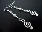 A PAIR OF  TIBETAN SILVER MUSICAL NOTE TREBLE CLEF THEMED   EARRINGS. NEW.