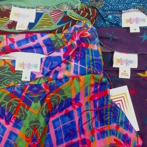 NEW Lula Roe Kids 4 Skirts 4 different patterns 4 Knee-Length Skirts sizes 4-6 - Picture 1 of 7