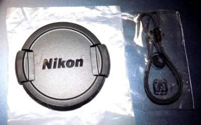 Nikon Camera Lens Cap Model# LC- CP 25 Lense Cover + Lanyard New In Package - Image 1 of 3