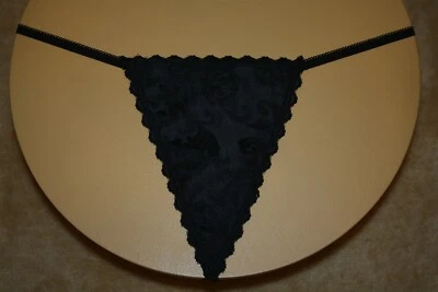 Tanga negra brillante con diseños florales en la parte delantera - S/M Foto 1 de 2