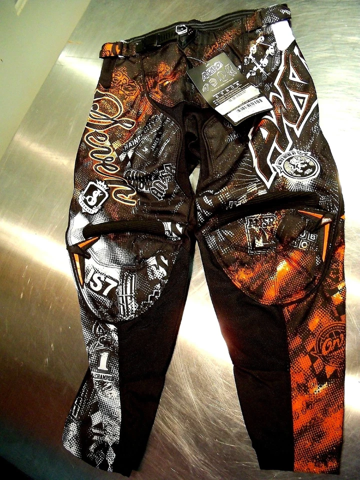 NOS ANSWER 450814 JAMES STEWART COLL A12 SEVEN PANTS BLACK ORANGE SIZE YOUTH 24 - Image 1 of 1