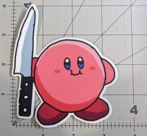 "Korbie" hält ein Messer! gestanzter Aufkleber, wasserdicht, UV beständig zwei Stile Kirb - Bild 1 von 3