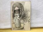 Young lady in hat holding flowering tree blossom Posted Universal Series 188 No1
