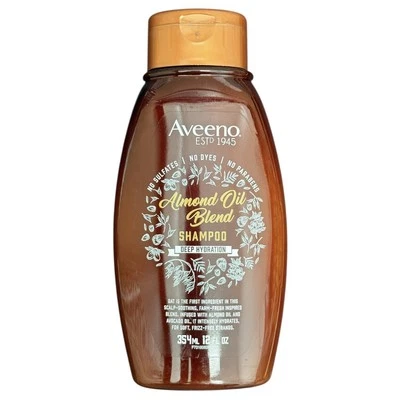 Champú de hidratación profunda con mezcla de aceite de almendras Aveeno 12 fl oz. Foto 1 de 2