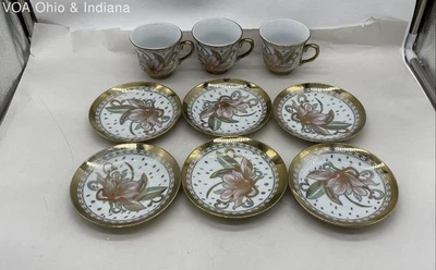 Juego vintage de tazas de té y platillos de porcelana con decoración floral Foto 1 de 4
