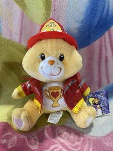 RARO DIFÍCIL DE ENCONTRAR NUEVO CON ETIQUETAS 10" PELUCHE CHAMP TROFEO BOMBERO CELEBRACIÓN CUIDADO OSO 2005 JUGUETE RETRO - Imagen 1 de 6