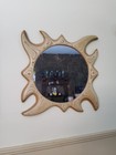 vintage handcrafted plywood sculptured sum mirror.