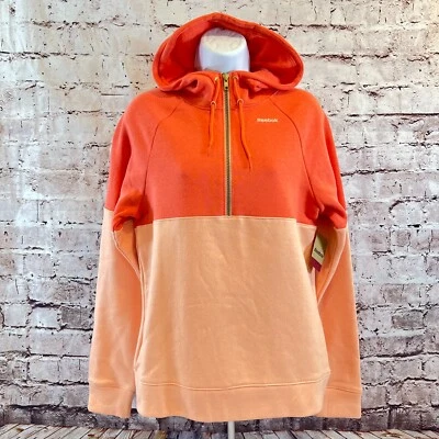 Suéter con capucha y cremallera Reebok coral melocotón 1/4 polar talla mediana para mujer Foto 1 de 4