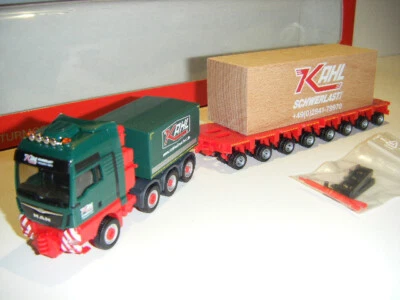 Herpa 310857 MAN TGX XXL 4-Achs Schwerlastzugmaschine Goldhofer Tieflader Kahl - Bild 1 von 4