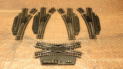 08. Trix Express Gleise H0: El. DKW,  2x El-Weiche rechts + 2x El.Weiche links - Bild 1 von 4