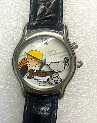 Reloj Musical Peanuts "Snoopy & Linus" de Armitron - Correa de Cuero Negro Foto 1 de 3