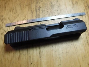 Lorcin L25,25 ac acp used Pistol Part, Slide,w/ extractor,,Black Aluminum. cc3 - Picture 1 of 5