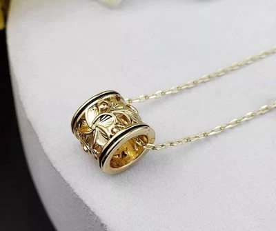 Collar Deslizante Barril Hawaiano Esmalte Negro Tono Dorado Foto 1 de 2