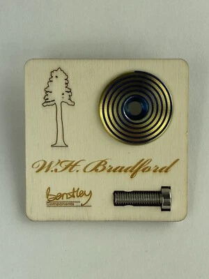 Titanium “yellow W/ blue spiral” top cap by Bentley Components for W.H.B Designs - Image 1 of 2