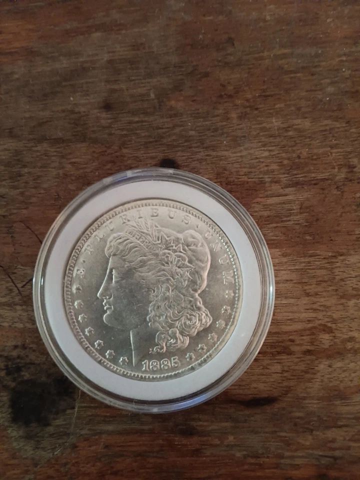 Dólar de plata Morgan 1885 CC circulado Foto 1 de 2