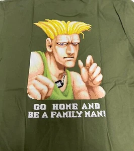 NWT - Uniqlo STREET FIGHTER GUILE Go Home and Be a Family Man UT Green T Shirt S - Picture 1 of 6