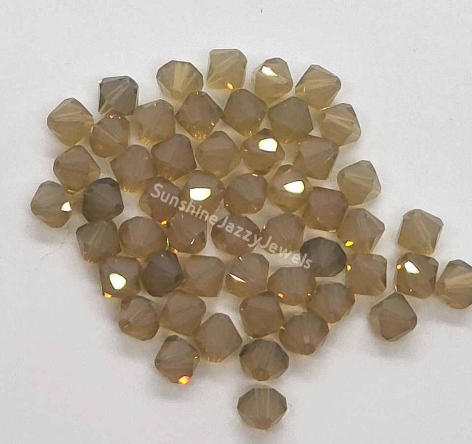 12pc Swarovski Crystal Sand Opal 6mm Bicone Beads; Light Brown - Image 1 of 1