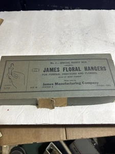 VINTAGE BOX OF FUNERAL HOME FLORAL FLOWER MEDAL HANGERS JAMES MFG TOLEDO,OHIO - Picture 1 of 5