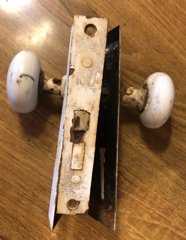 Salvage White Porcelain door knobs with lock mechanism and hardware Cover