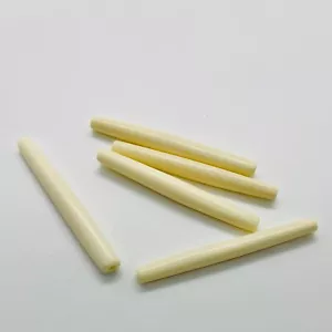 Horn bead (dyed), white, 65x6mm-65x8mm hand-cut hairpipe. Sold per pkg of 2. - Picture 1 of 1
