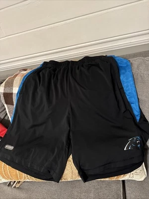 PANTALONES CORTOS DE FÚTBOL UNDER ARMOUR XL CAROLINA PANTHERS PARA HOMBRE Foto 1 de 4