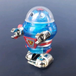 2008 Tomy Aufzieh-Weltraumroboter Laufspielzeug rot Chrom & durchscheinend blau 1-3/4 Zoll - Bild 1 von 6